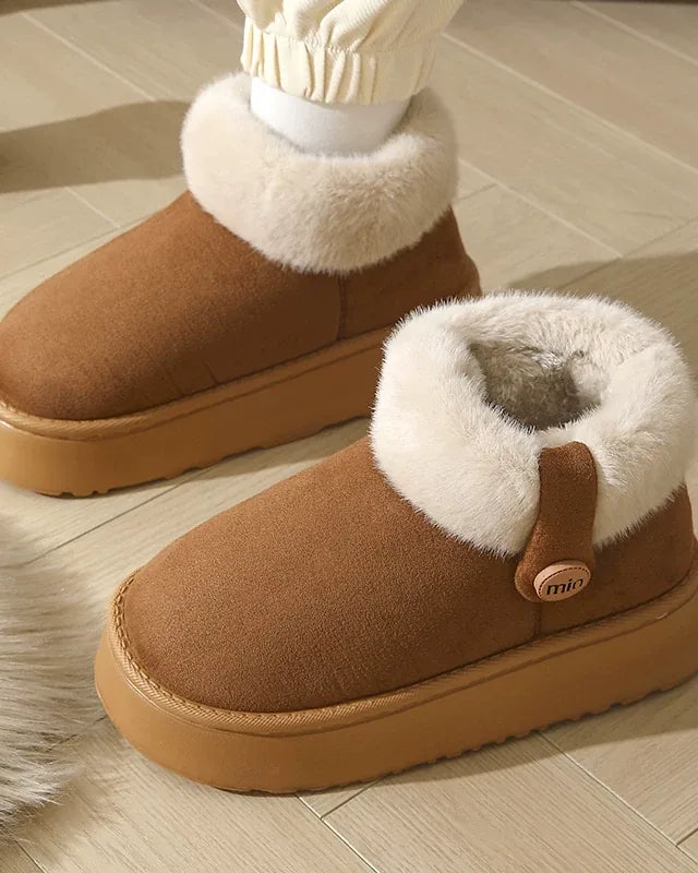 Close-up of a dark brown boot with its fur cuff folded down