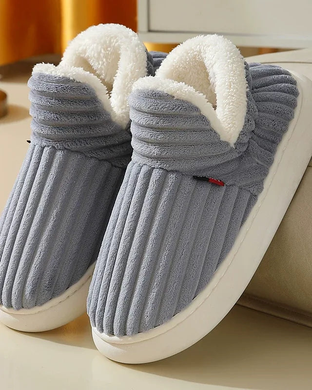 Pair of blue-gray ribbed plush slipper boots with a cream fleece collar and a white sole