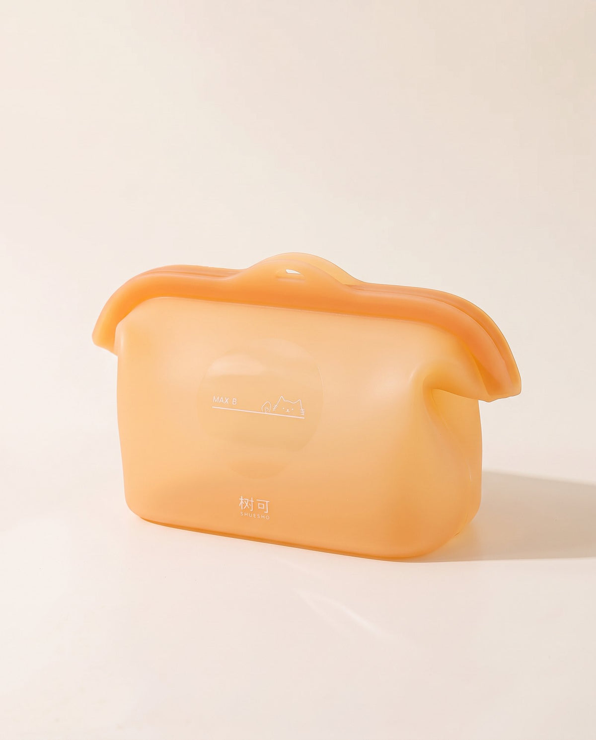 Apricot silicone storage bag in warm orange, standing upright